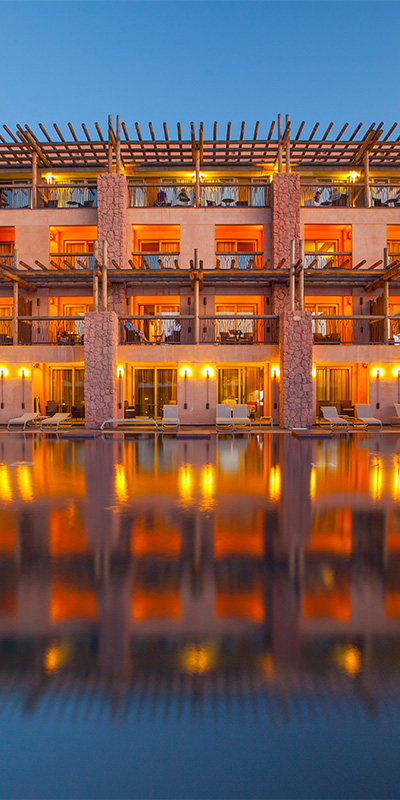  Dusk in the Tranquila pool of the hotel with African atmosphere Lopesan Baobab Resort in Meloneras, Gran Canaria 